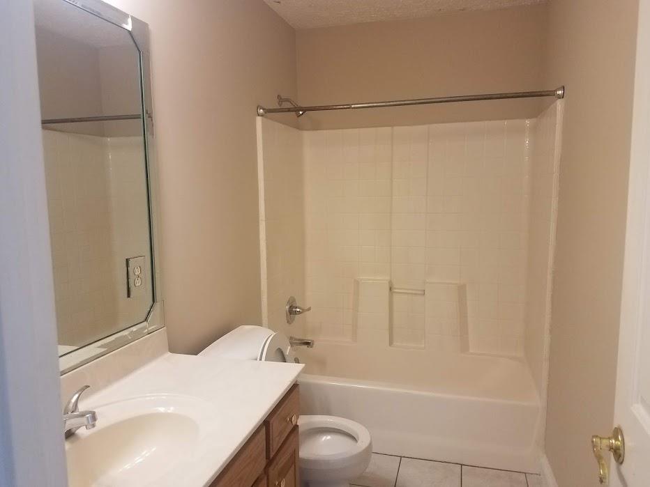 4686 Matthews Road Cedar Hill, TN 37032 - Photo 11 of 20 a bathroom with a sink and a mirror
