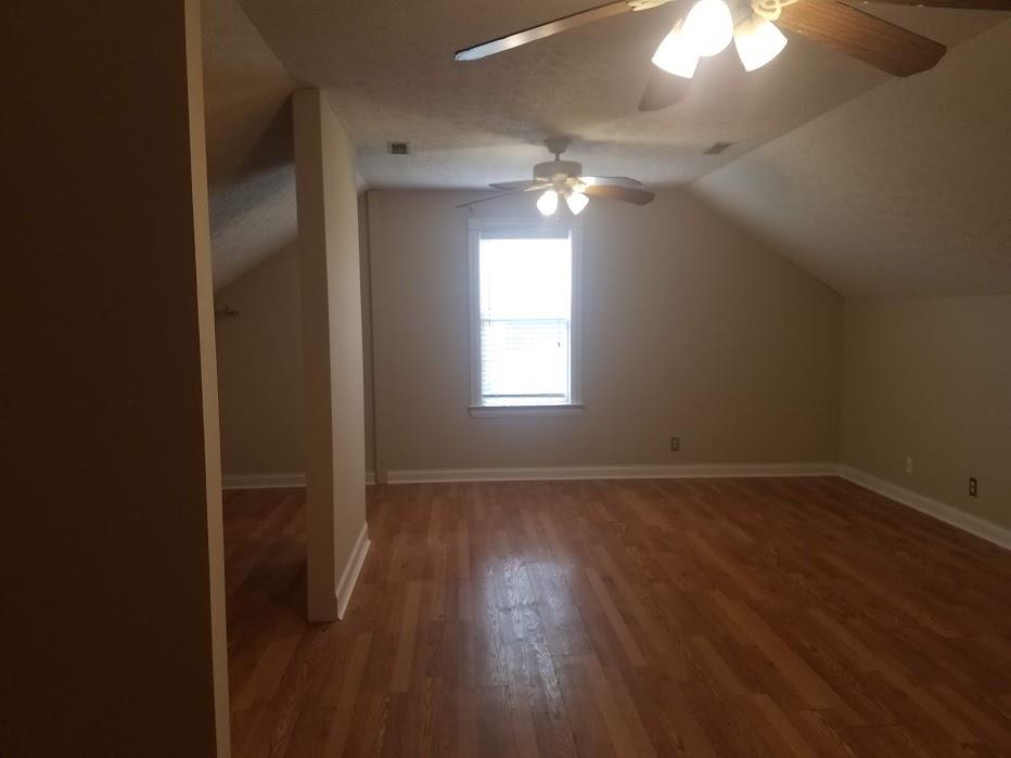 4686 Matthews Road Cedar Hill, TN 37032 - Photo 15 of 20 an empty room with wooden floor and windows