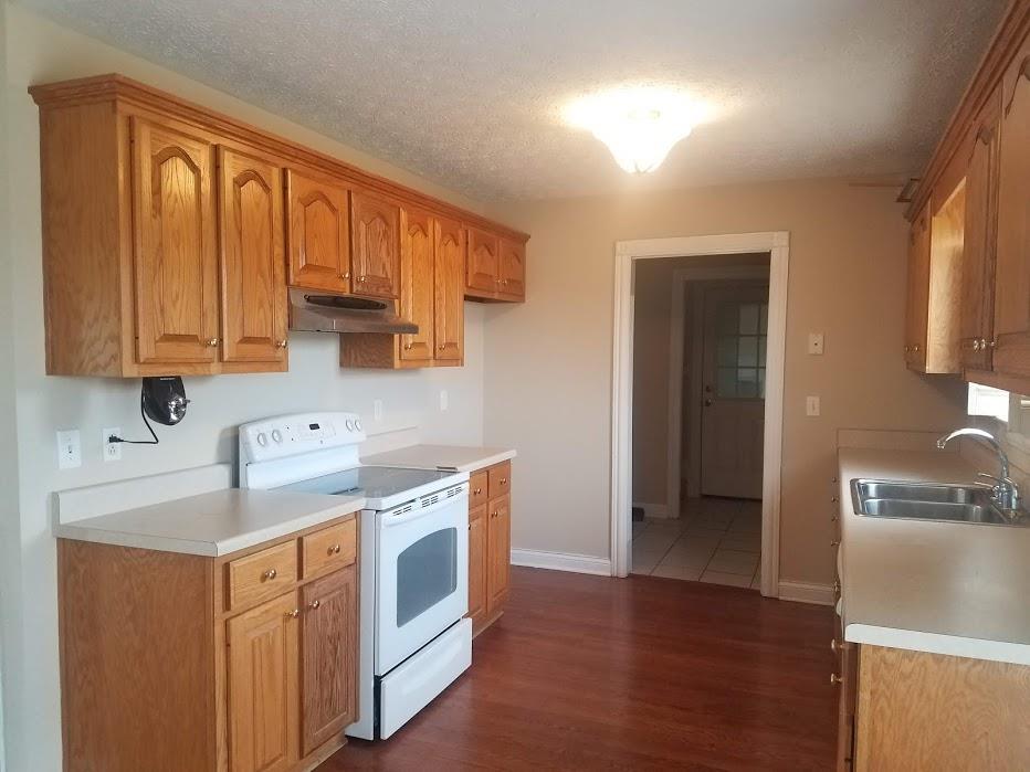 4686 Matthews Road Cedar Hill, TN 37032 - Photo 6 of 20 a view of a kitchen with electric appliances