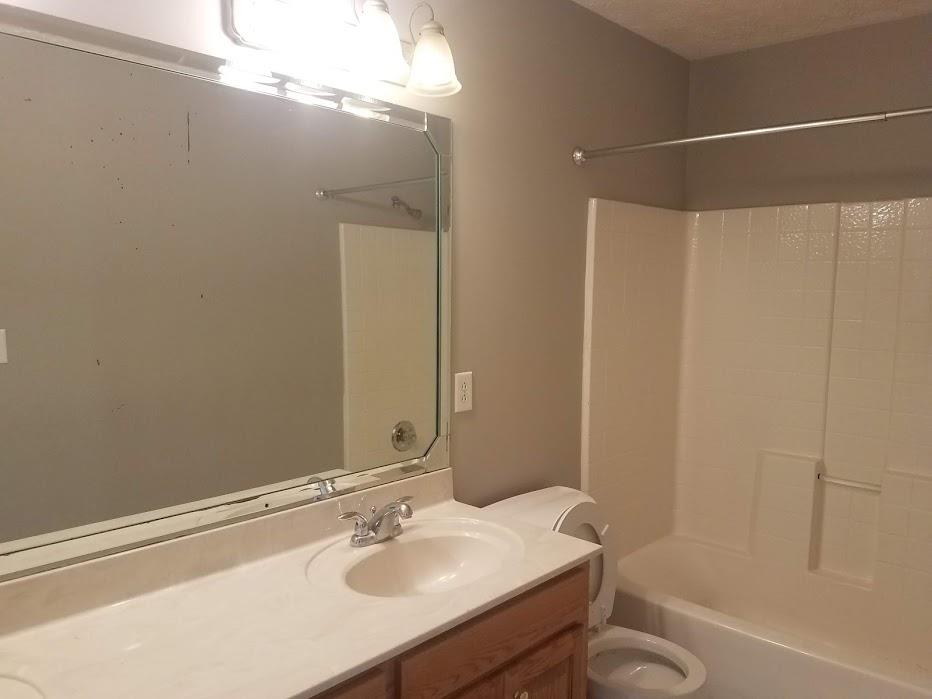 4686 Matthews Road Cedar Hill, TN 37032 - Photo 8 of 20 a bathroom with a sink and a mirror