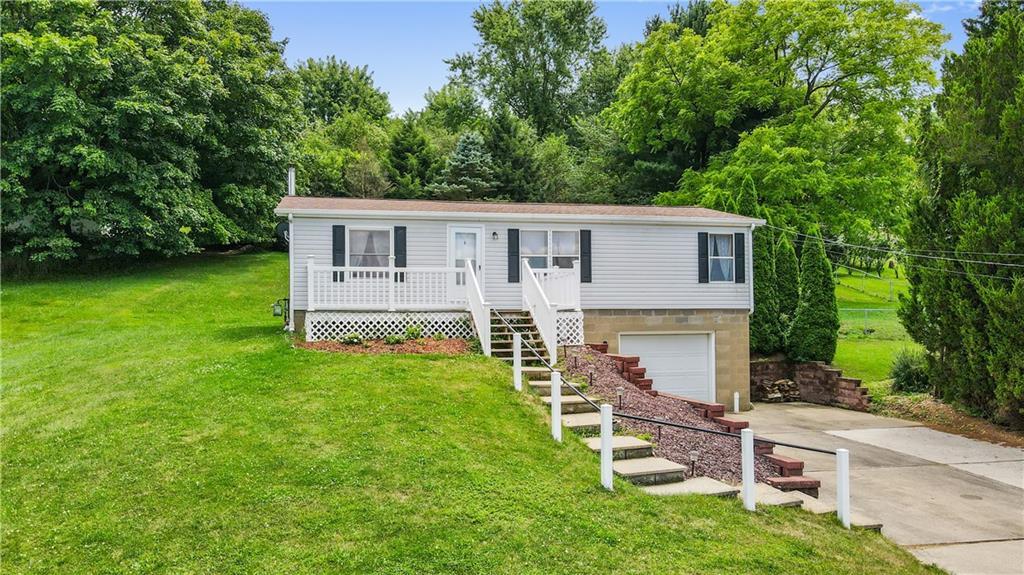 14 Belgium Hill Road Cecil, PA 15321 - Photo 1 of 16 a view of a house with a backyard and a patio