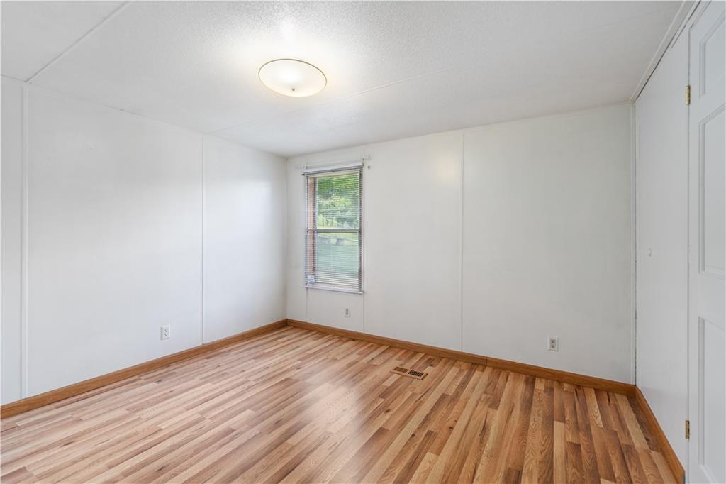14 Belgium Hill Road Cecil, PA 15321 - Photo 10 of 16 a view of room with window and wooden floor