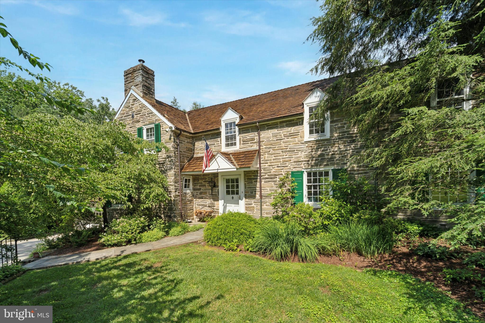 409 Marple Road Broomall, PA 19008 - Photo 2 of 37 a front view of a house with a yard and potted plants