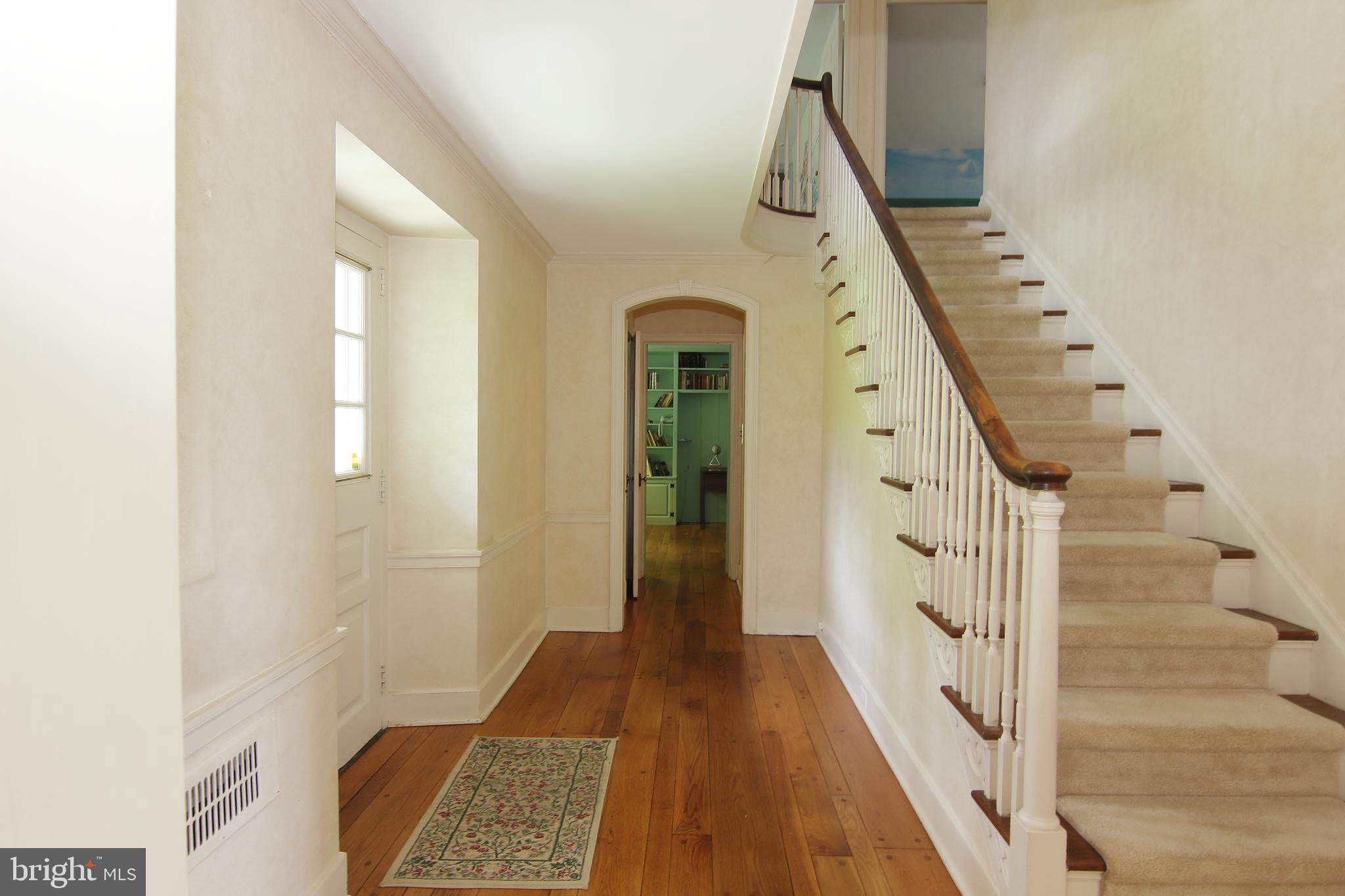 409 Marple Road Broomall, PA 19008 - Photo 24 of 37 a view of a hallway with wooden floor and entryway