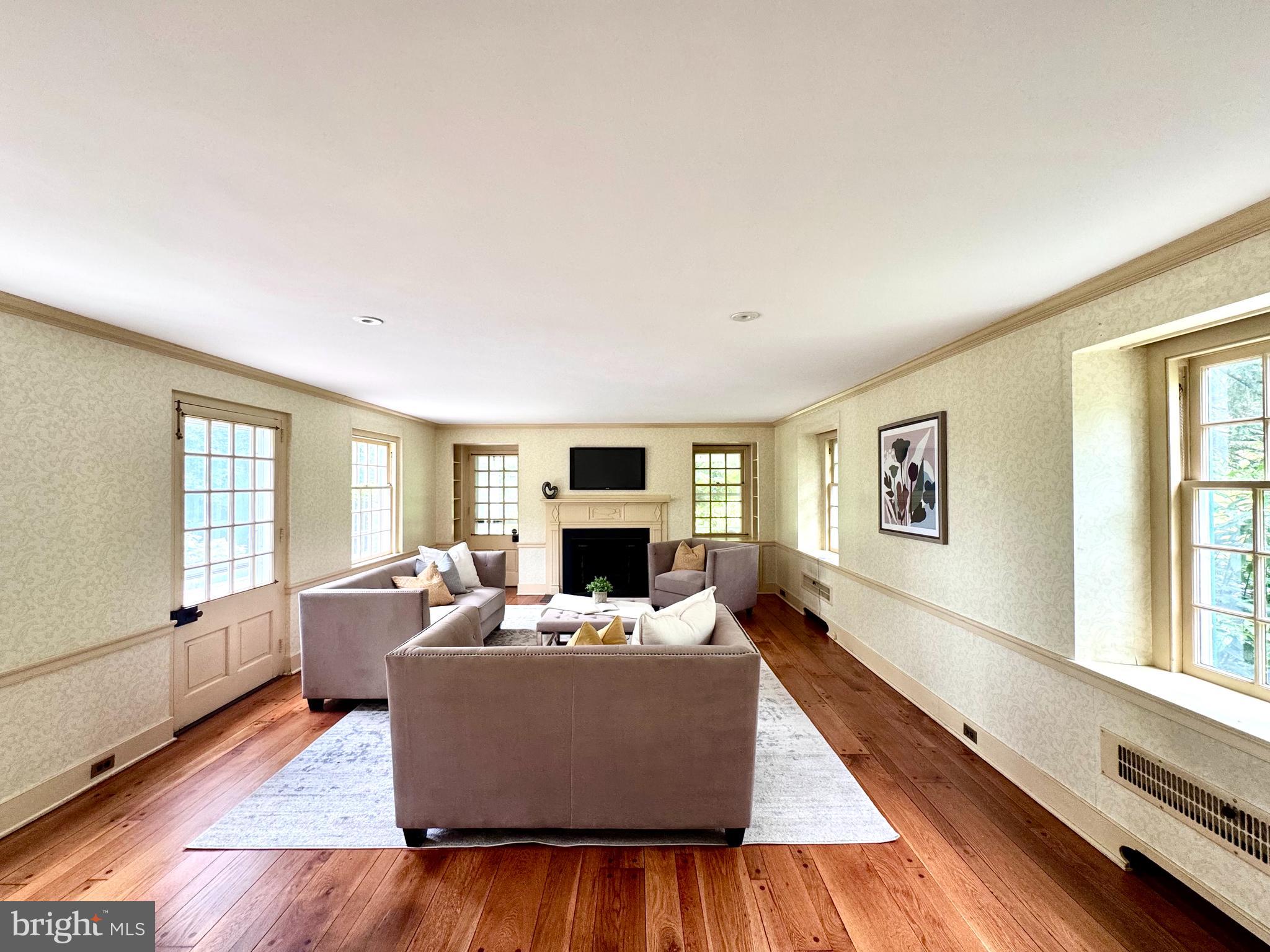 409 Marple Road Broomall, PA 19008 - Photo 5 of 37 a living room with furniture wooden floor and windows