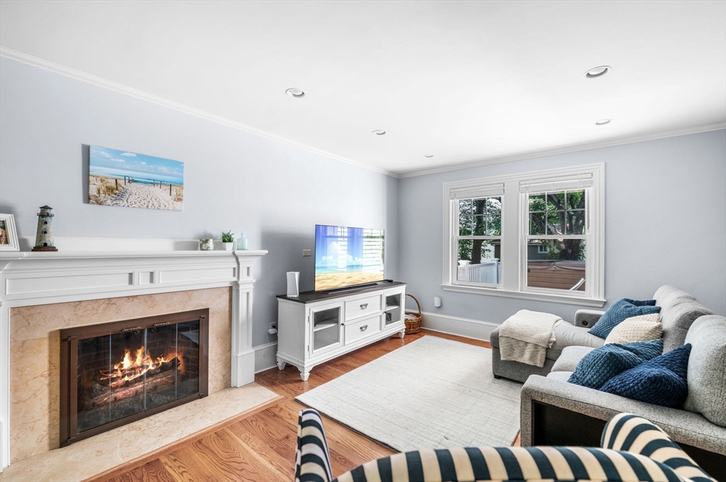 22 Robbins Road Watertown, MA 02472 - Photo 11 of 30 a living room with furniture and a fireplace