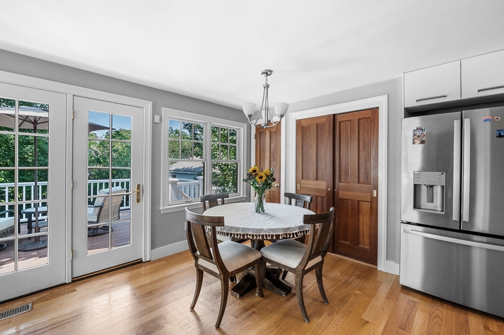 22 Robbins Road Watertown, MA 02472 - Photo 19 of 30 a view of a dining room with furniture window and wooden floor