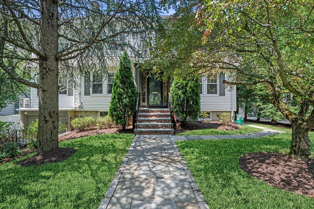 22 Robbins Road Watertown, MA 02472 - Photo 2 of 30 a front view of a house with garden