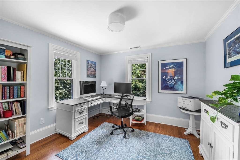 22 Robbins Road Watertown, MA 02472 - Photo 23 of 30 a view of a workspace with furniture and a potted plant