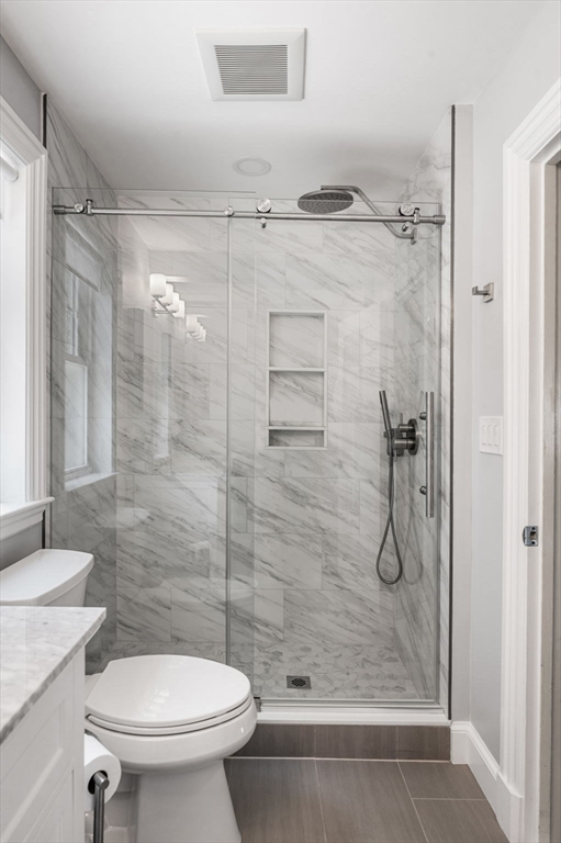 22 Robbins Road Watertown, MA 02472 - Photo 25 of 30 a bathroom with a shower and a toilet