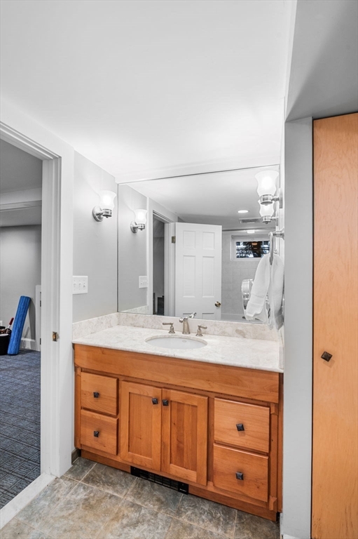 22 Robbins Road Watertown, MA 02472 - Photo 26 of 30 a spacious bathroom with a granite countertop sink mirror and double