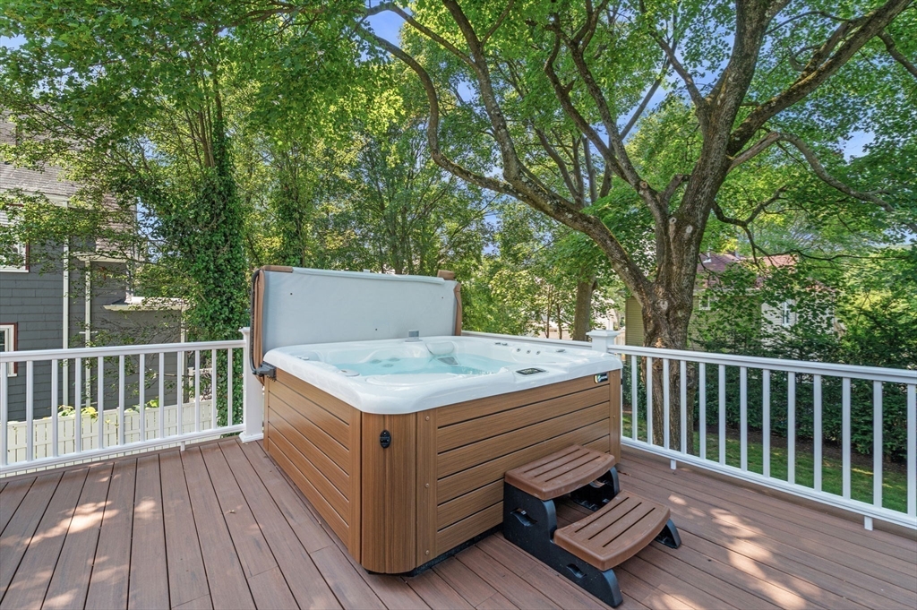 22 Robbins Road Watertown, MA 02472 - Photo 29 of 30 a view of barbeque grill with wooden floor and fence