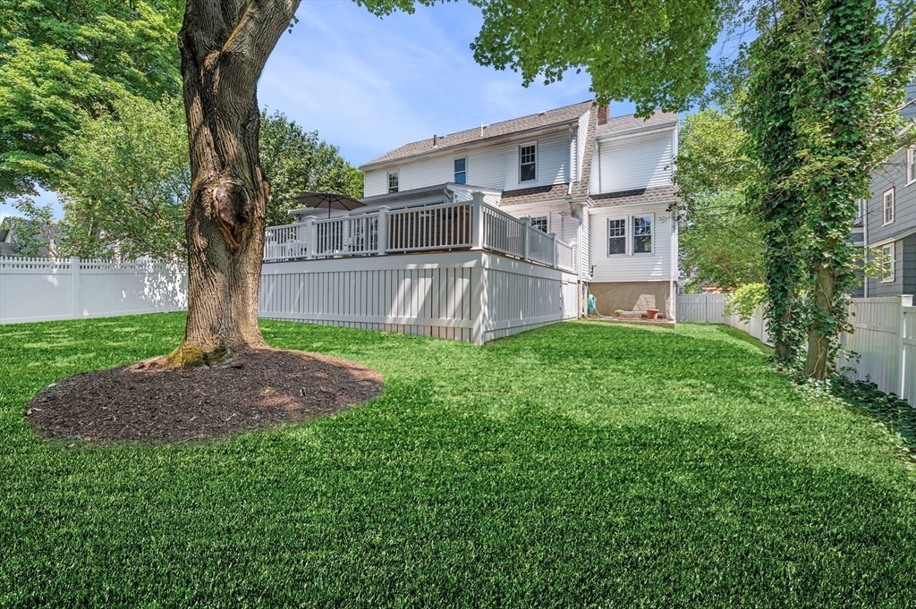 22 Robbins Road Watertown, MA 02472 - Photo 4 of 30 a white house that has tree in front of it