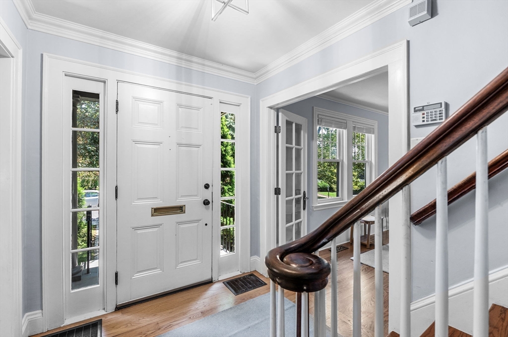 22 Robbins Road Watertown, MA 02472 - Photo 7 of 30 a view of entryway with wooden floor and stairs