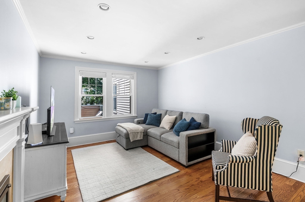 22 Robbins Road Watertown, MA 02472 - Photo 10 of 30 a living room with furniture and a large window