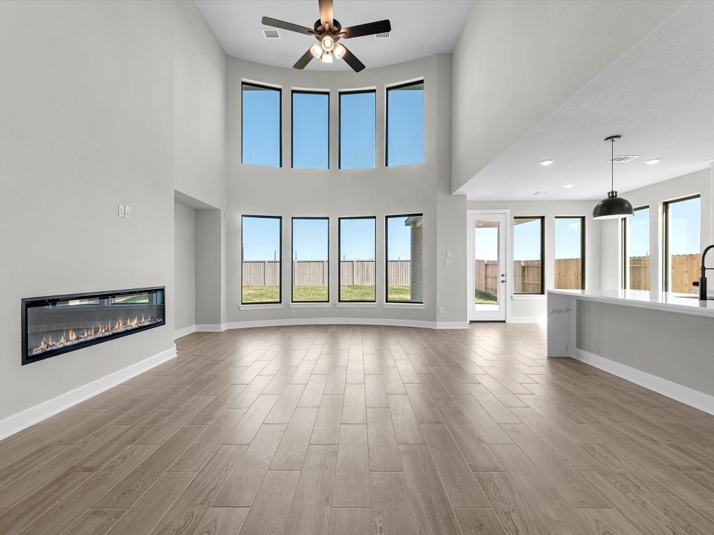 213 Buckaroo Drive Georgetown, TX 78633 - Photo 4 of 22 a view of an empty room with wooden floor and a window