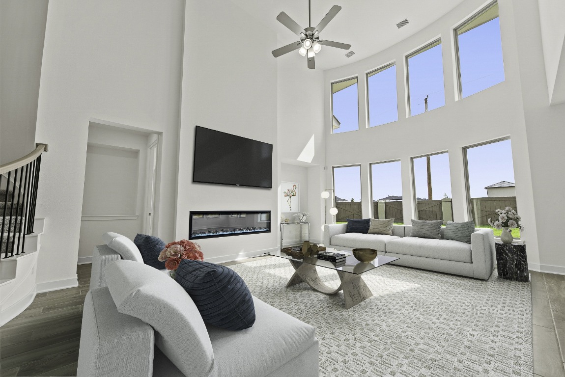 213 Buckaroo Drive Georgetown, TX 78633 - Photo 8 of 22 a living room with furniture fireplace and a flat screen tv