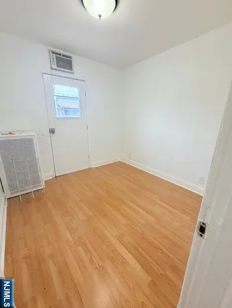 a room with a bed and cabinets
