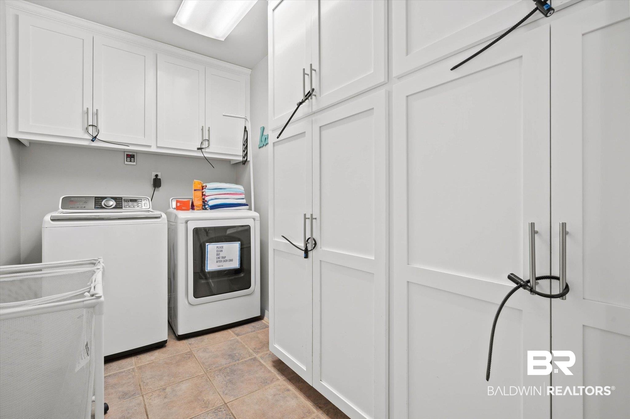 3720 Rabbit Creek Court Theodore, AL 36582 - Photo 18 of 47 Laundry area with separate washer and dryer and cabinet space
