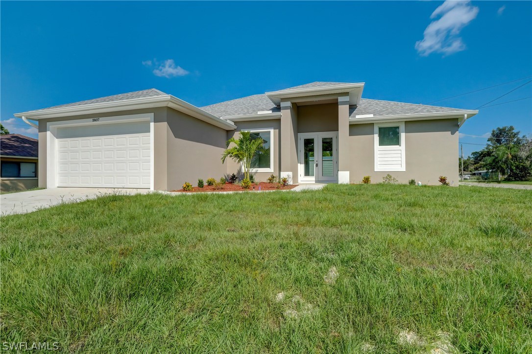 a view of a house with a yard