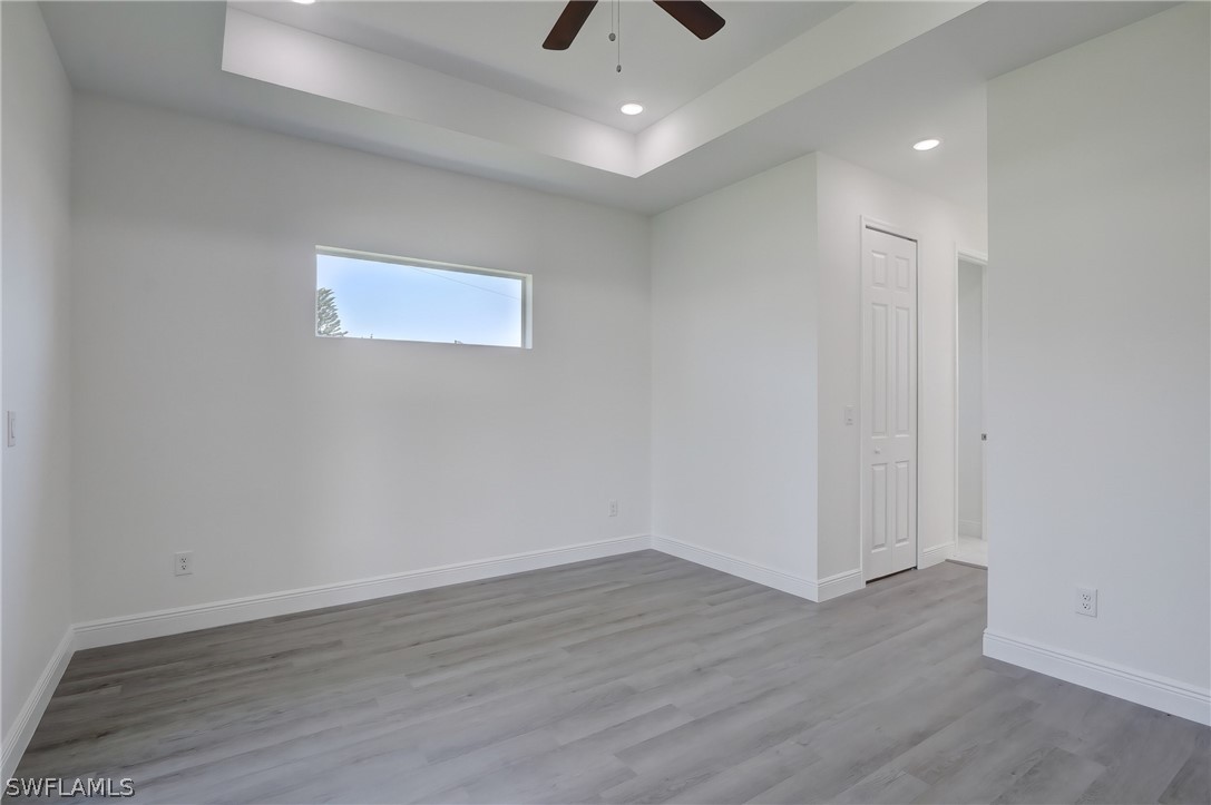 18457 Lee Road Fort Myers, FL 33967 - Photo 19 of 28 wooden floor in an empty room