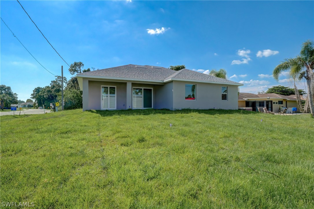 18457 Lee Road Fort Myers, FL 33967 - Photo 2 of 28 a house view with a garden space