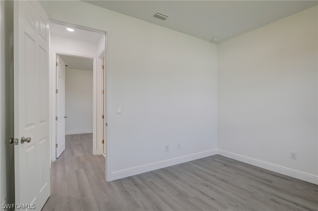18457 Lee Road Fort Myers, FL 33967 - Photo 21 of 28 a view of a room with wooden floor
