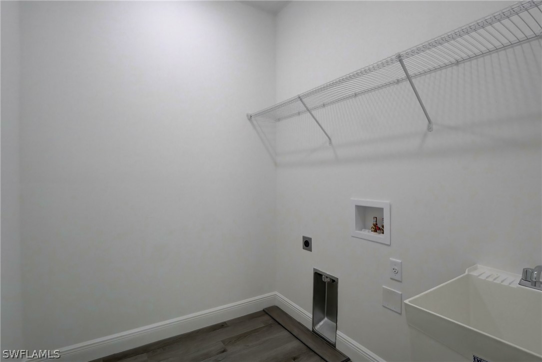 18457 Lee Road Fort Myers, FL 33967 - Photo 24 of 28 a view of a room with racks on the wall