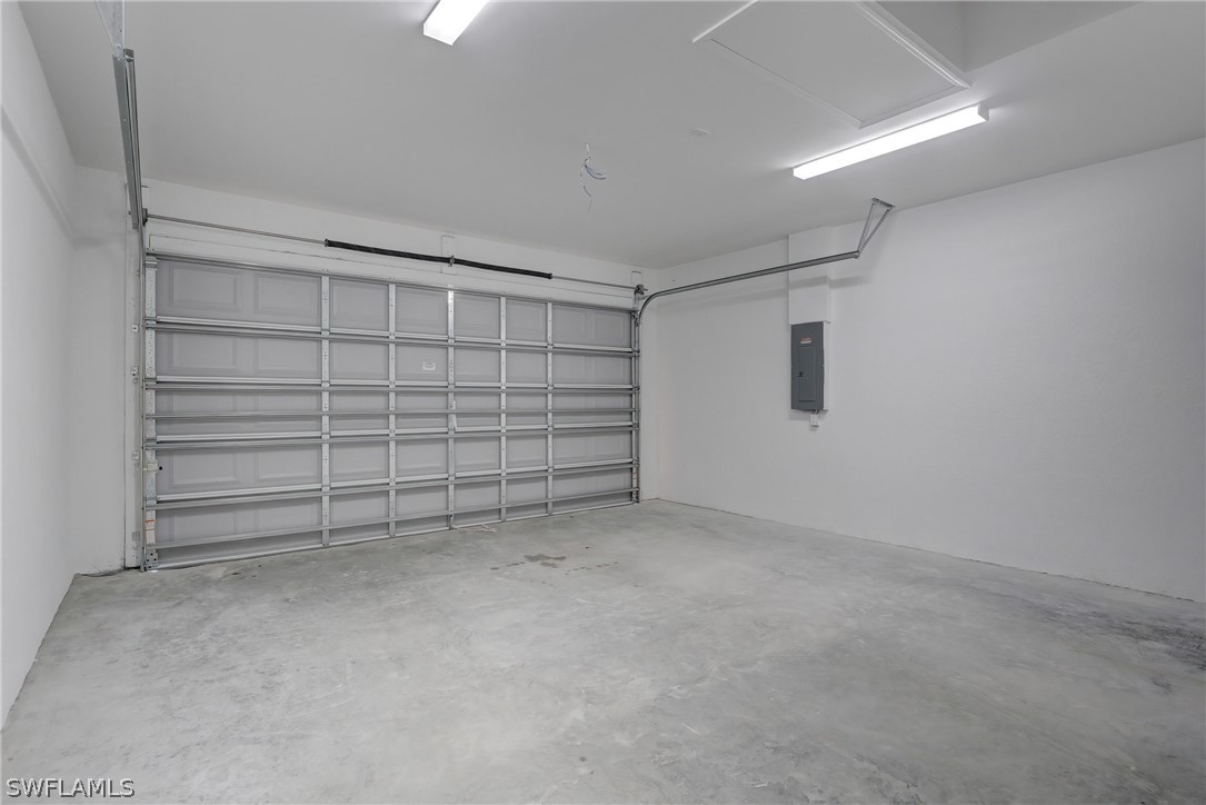 18457 Lee Road Fort Myers, FL 33967 - Photo 25 of 28 a view of an empty room with closet and lots of racks