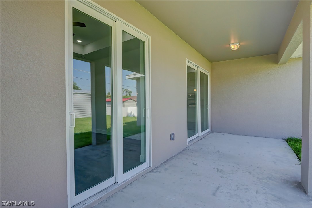 18457 Lee Road Fort Myers, FL 33967 - Photo 26 of 28 a view of a hallway with an empty room