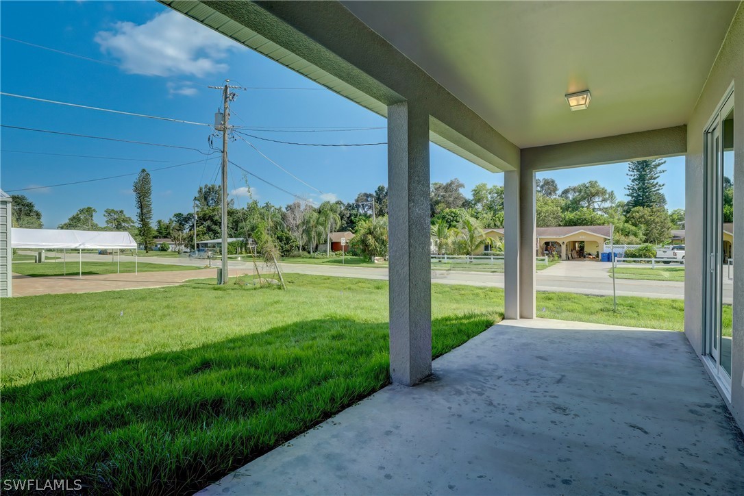 18457 Lee Road Fort Myers, FL 33967 - Photo 27 of 28 a view of a house with backyard and porch