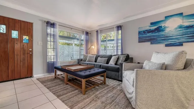 a living room with furniture and a window