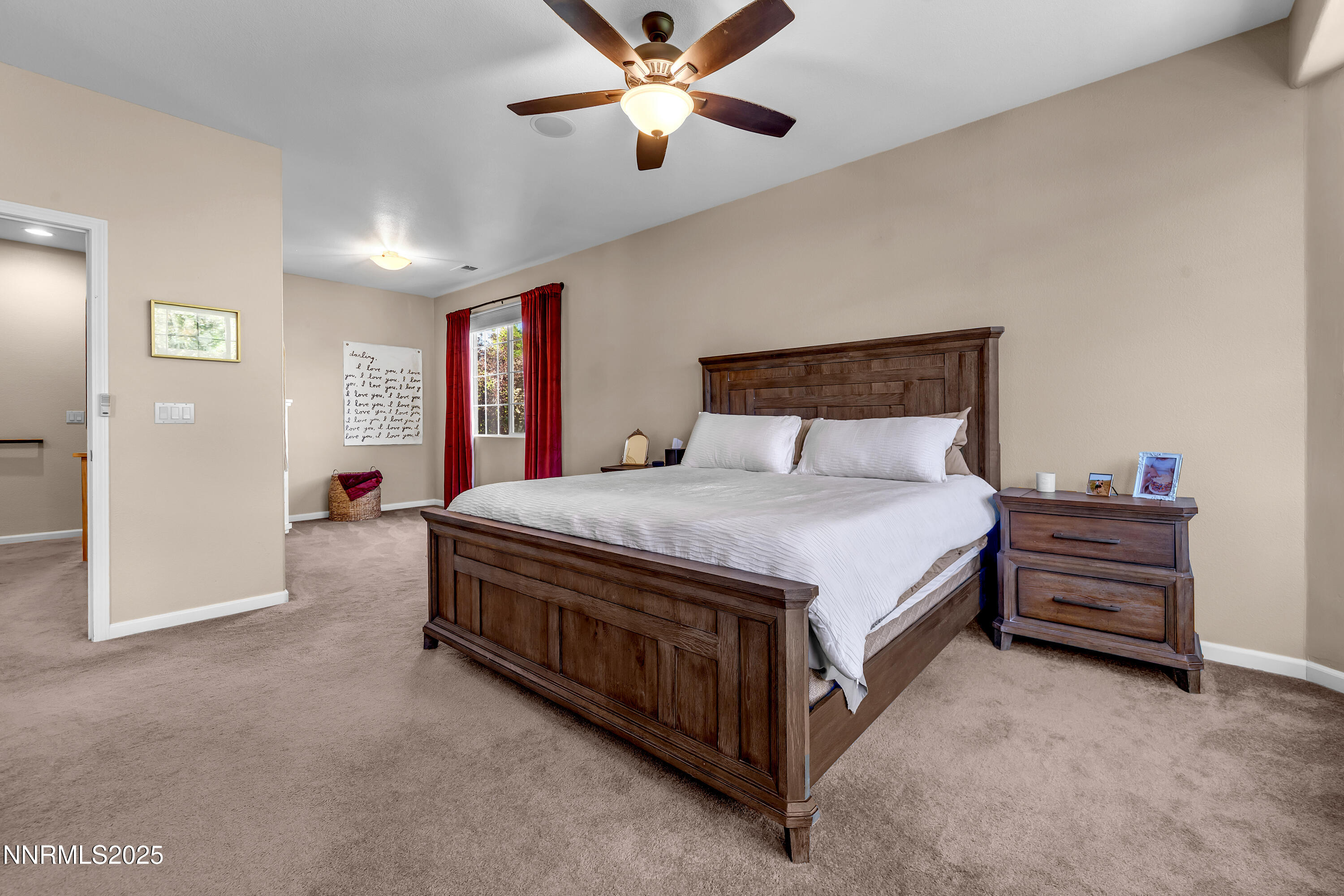 1811 Stetson Drive Reno, NV 89521 - Photo 13 of 34 a spacious bedroom with a bed and a chandelier