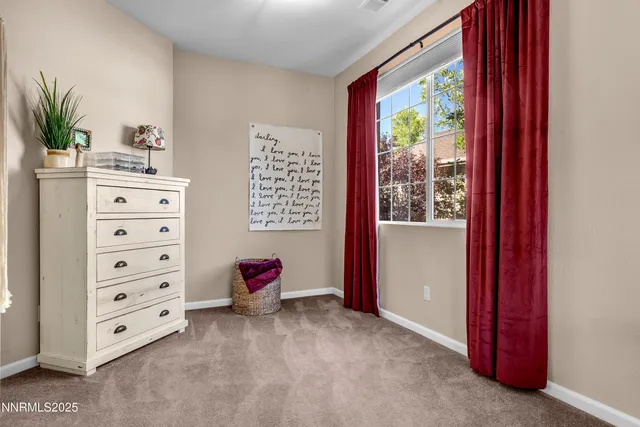 a view of room with window and cabinet