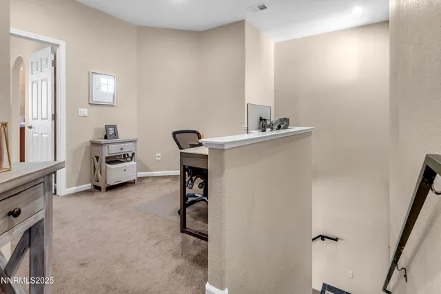 a room with furniture and white walls