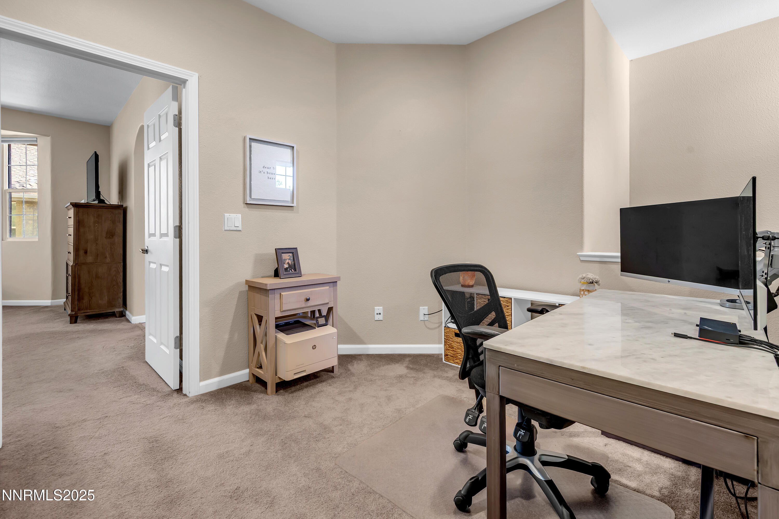 1811 Stetson Drive Reno, NV 89521 - Photo 19 of 34 a view of a workspace with furniture and a flat screen tv