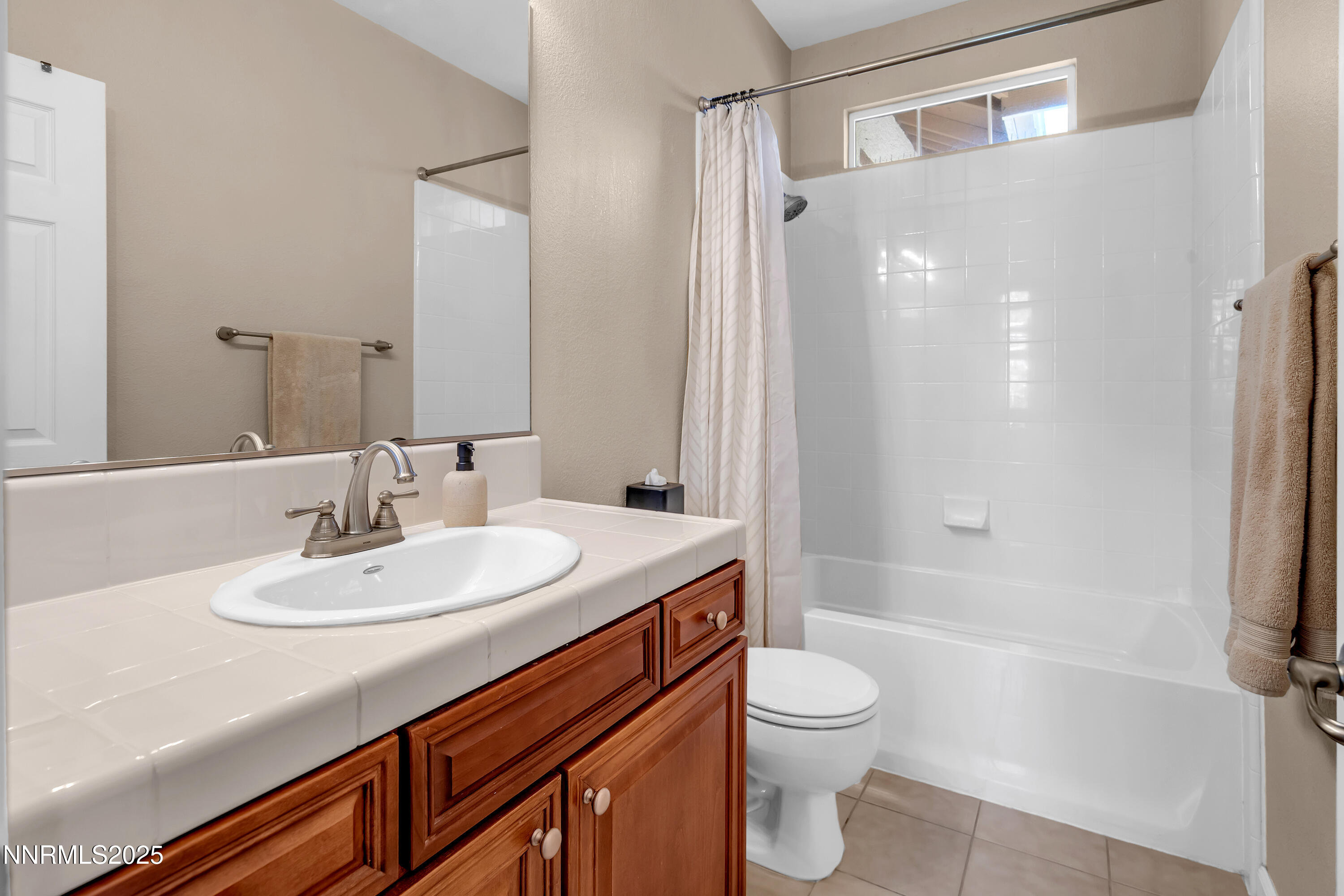 1811 Stetson Drive Reno, NV 89521 - Photo 24 of 34 a bathroom with a sink a toilet and shower