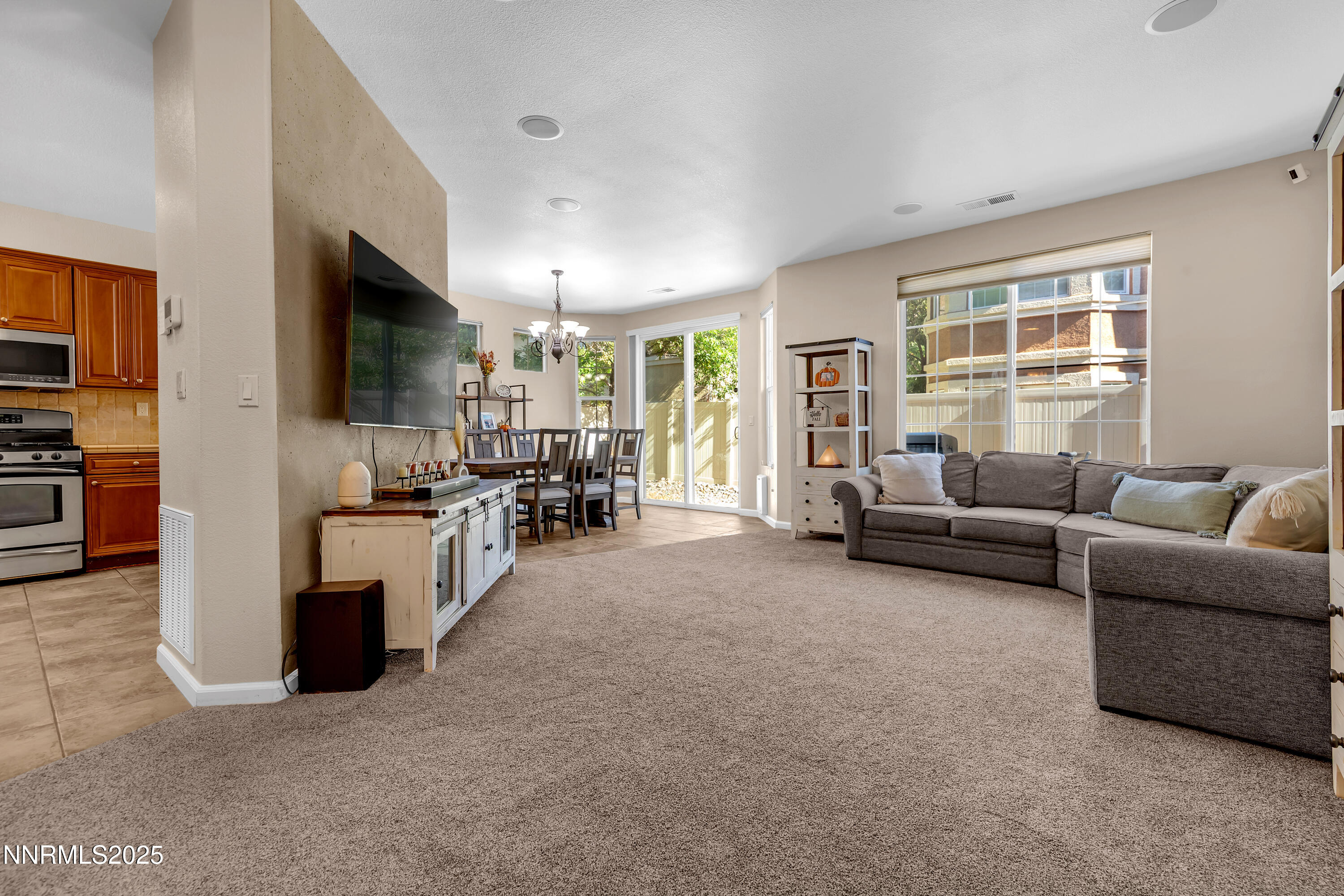 1811 Stetson Drive Reno, NV 89521 - Photo 3 of 34 a living room with furniture and a flat screen tv