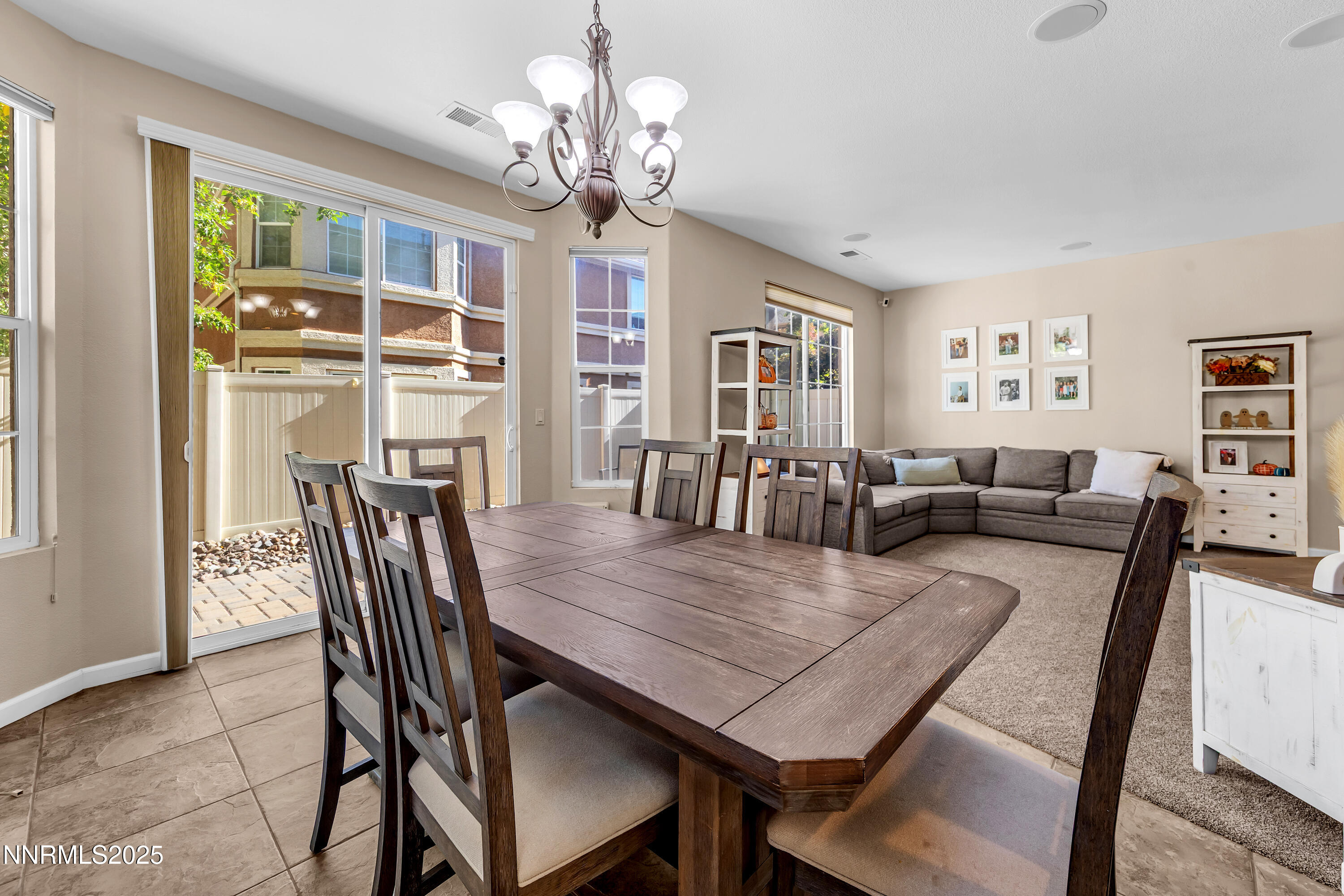 1811 Stetson Drive Reno, NV 89521 - Photo 6 of 34 a view of a dining room with furniture a chandelier and wooden floor