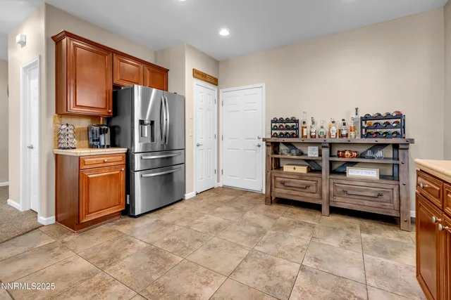 a kitchen with stainless steel appliances a refrigerator and a stove