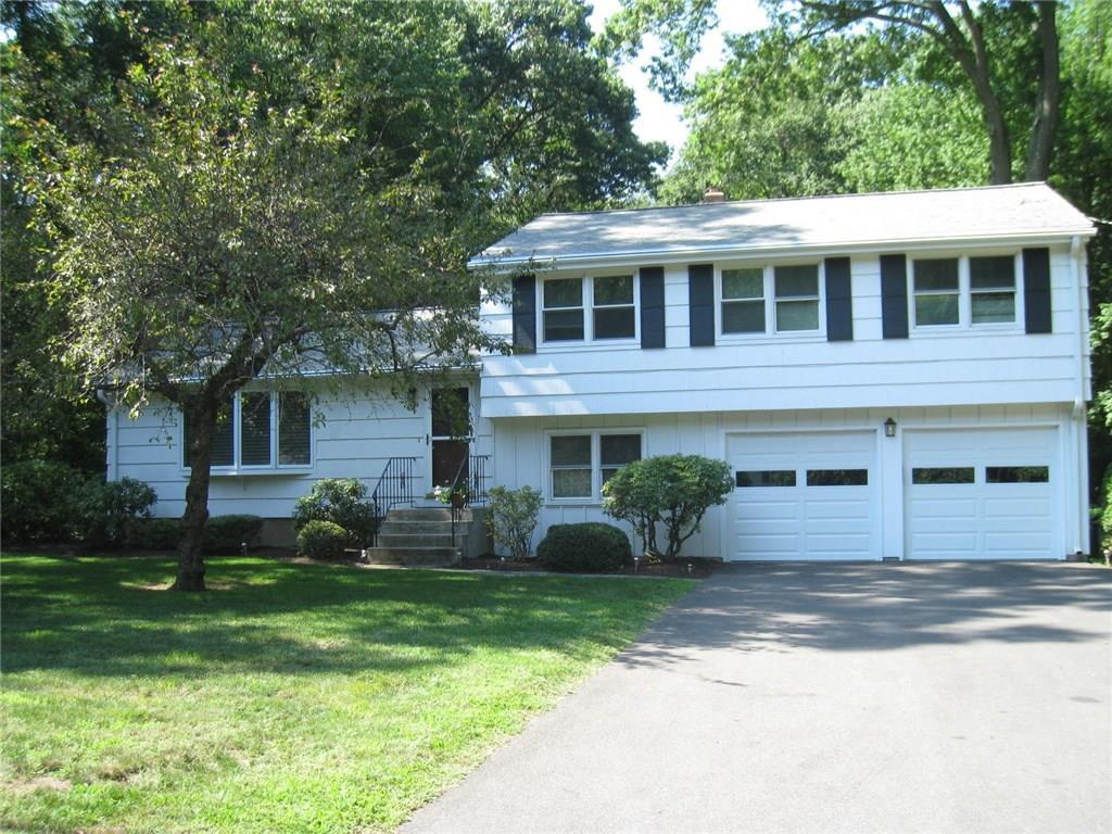 271 Hemlock Hill Road Orange, CT 06477 - Photo 1 of 1 a front view of a house with a yard and trees