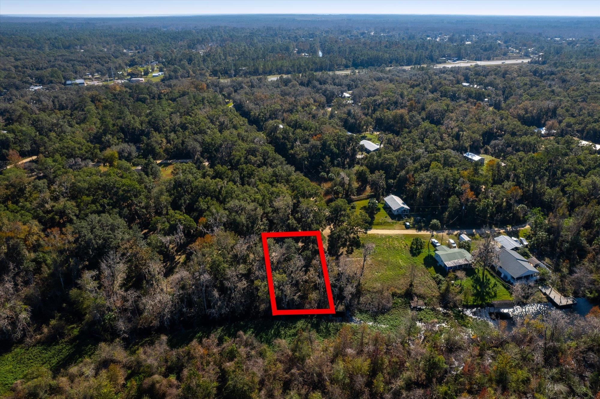 114 Ridgeline Avenue Satsuma, FL 32189 - Photo 8 of 14 an aerial view of residential house with outdoor space and trees