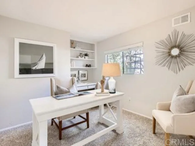 a view of a workspace with furniture