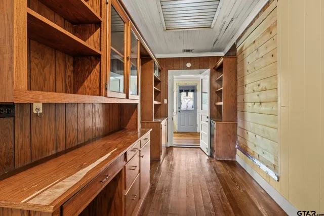 a view of a balcony with wooden floor and staircase