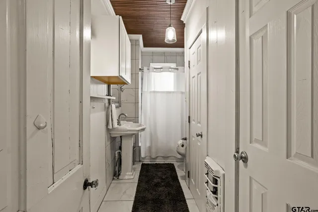 a bathroom with a sink and mirror
