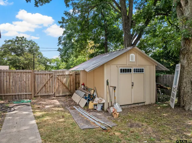a view of a small house in the back yard