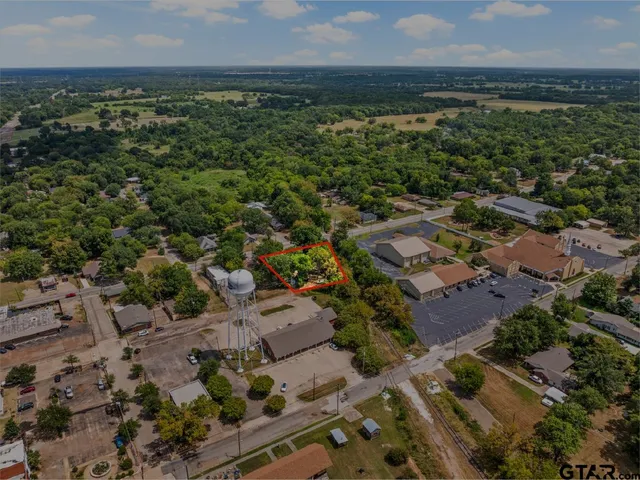 an aerial view of residential house with outdoor space