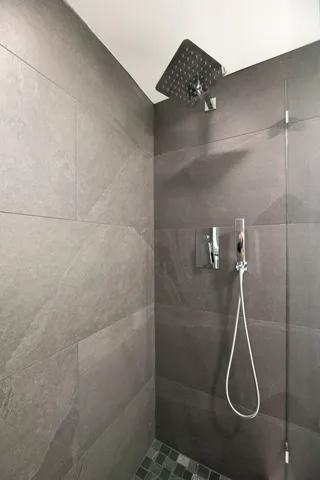 an aerial view of a house with a lake view