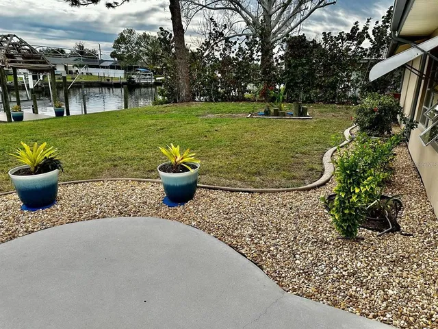 a view of a dining room with furniture and window