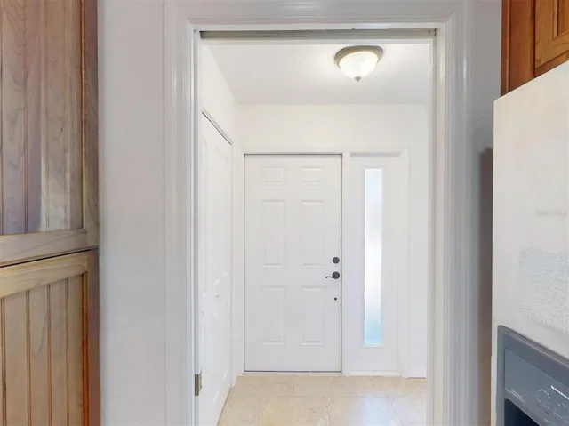 a kitchen with stainless steel appliances kitchen island granite countertop a stove a sink and a microwave